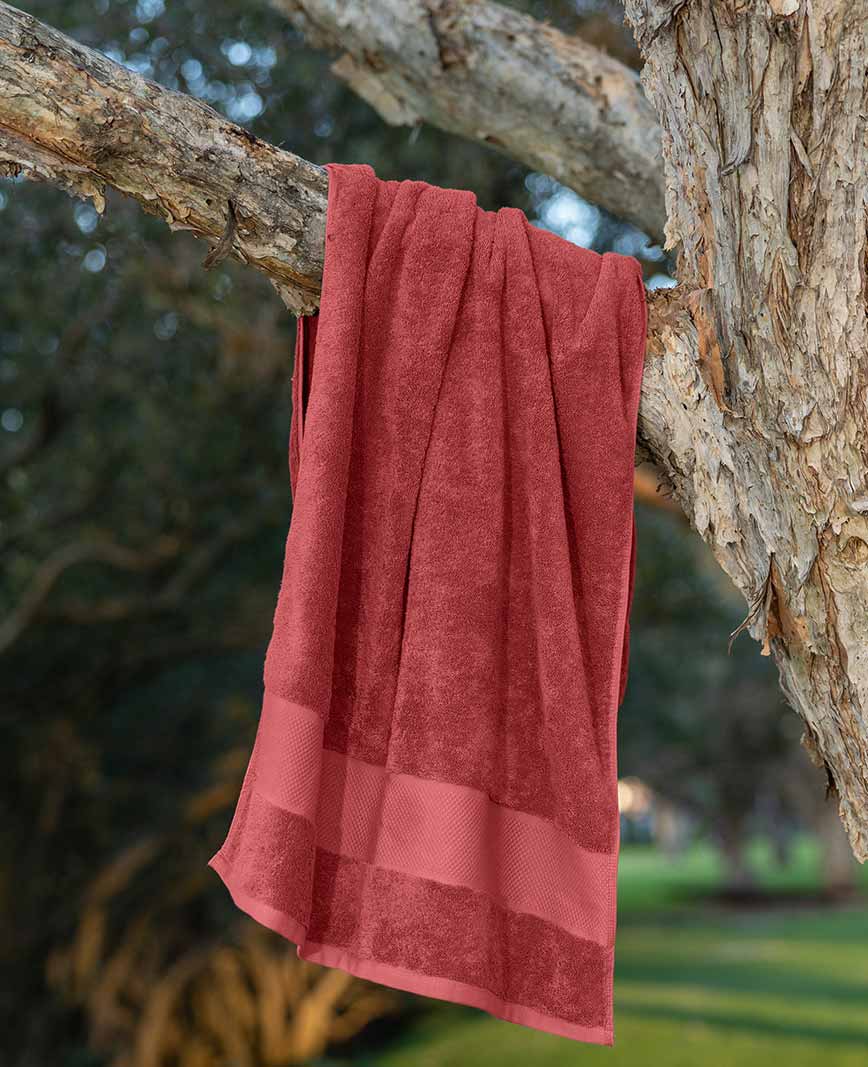 Embrace boho-chic vibes with Ornamajo's vibrant red towels, adding a pop of color and style to your eclectic bathroom sanctuary.